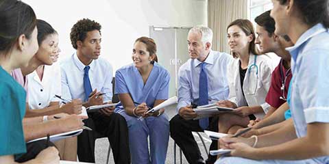 health care providers discuss during timeout before surgery